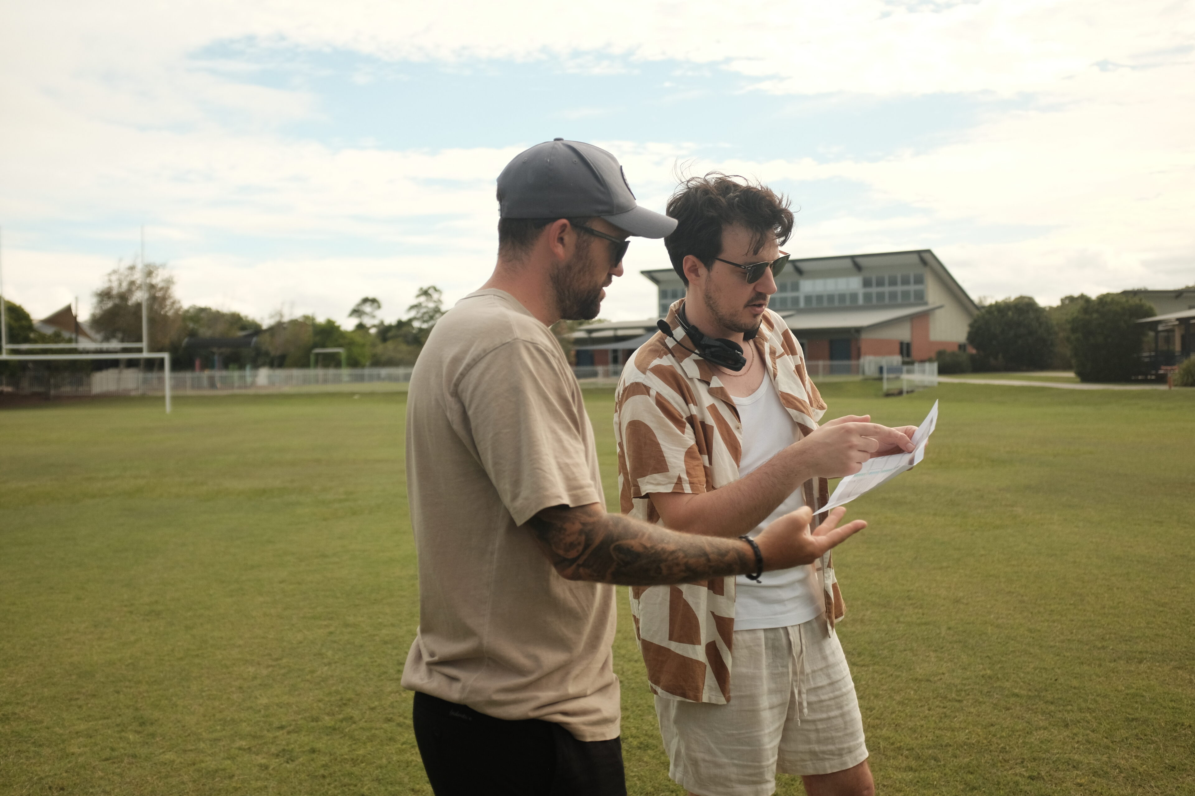 Director and cinematographer on commercial video read script and plan shots